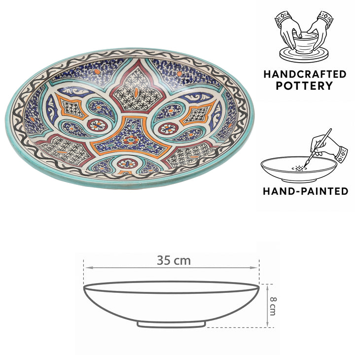 Ciotola in ceramica marocchina di Fès, dipinta e modellata a mano, con vivaci motivi floreali e geometrici, Ø 35 cm e 8 cm di altezza